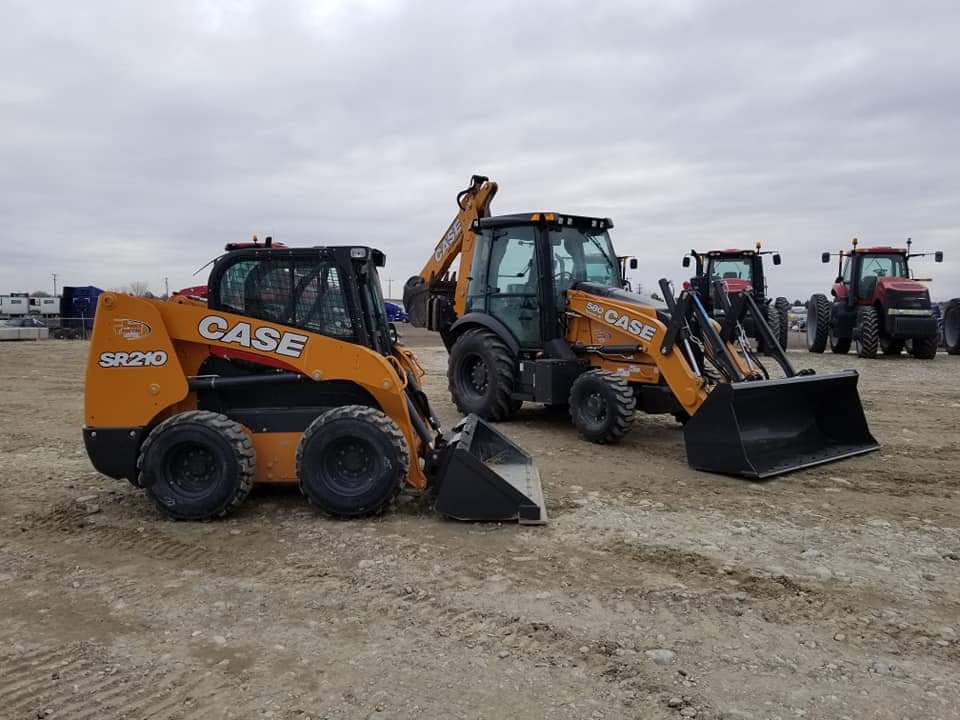 Lewis Excavation equipment lined up in the yard